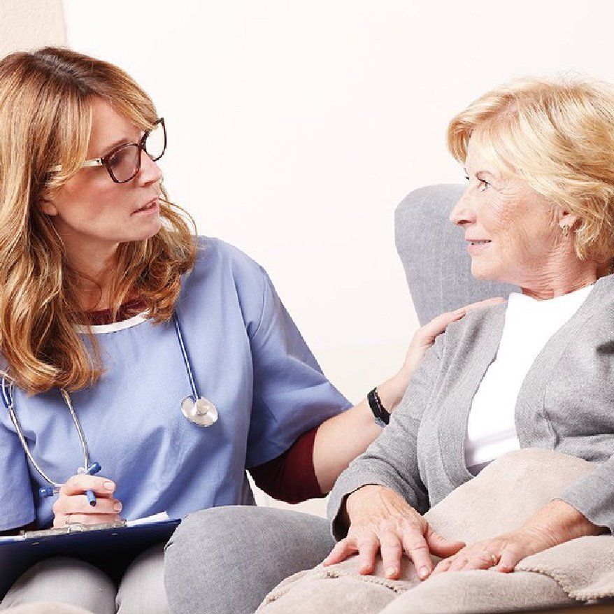 Physician consults with patient Physician consults with patient