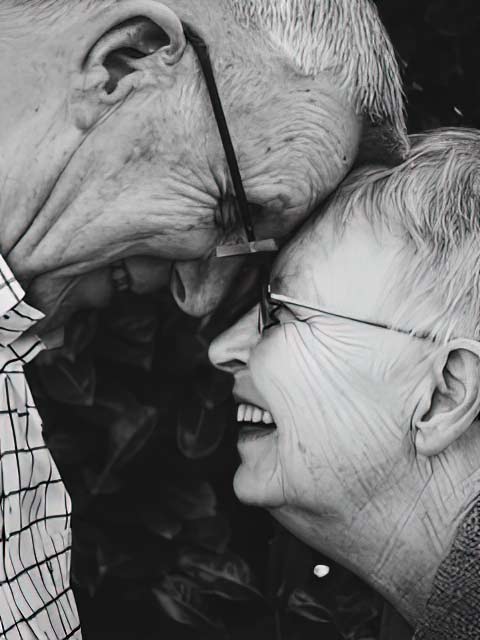 Couple smile and face each other Couple smile and face each other