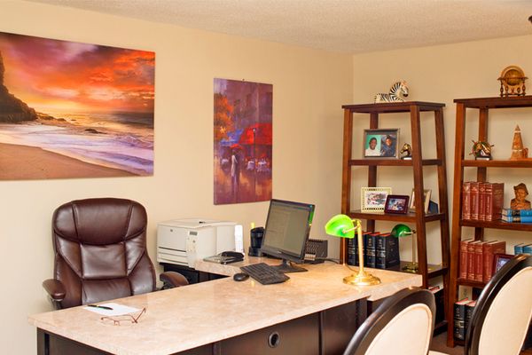 A desk with a computer on it in a home office
