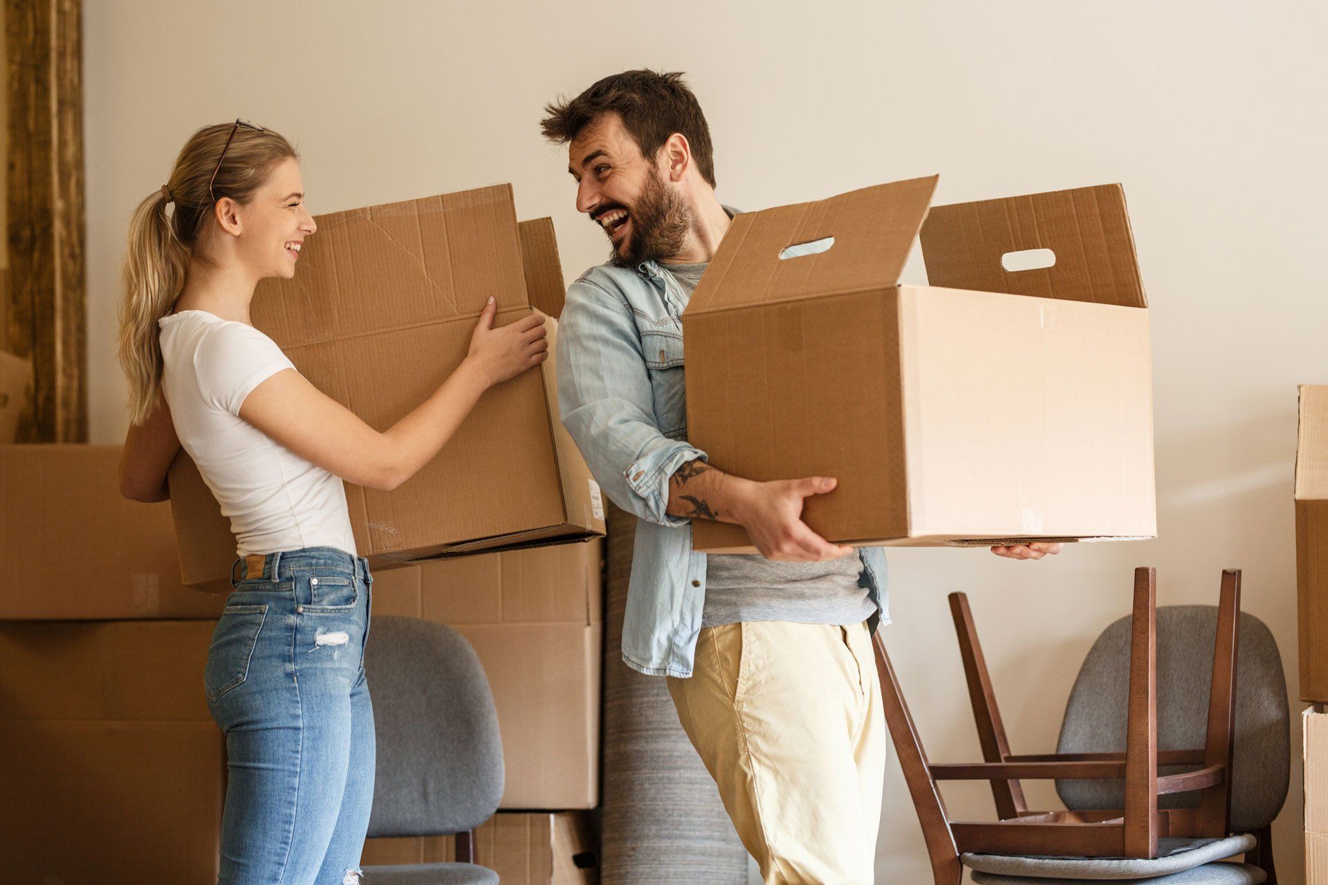 Delivery Man Holding Cardboard Boxes — Australia — Australian Moving Logistics Delivery Man Holding Cardboard Boxes — Australia — Australian Moving Logistics