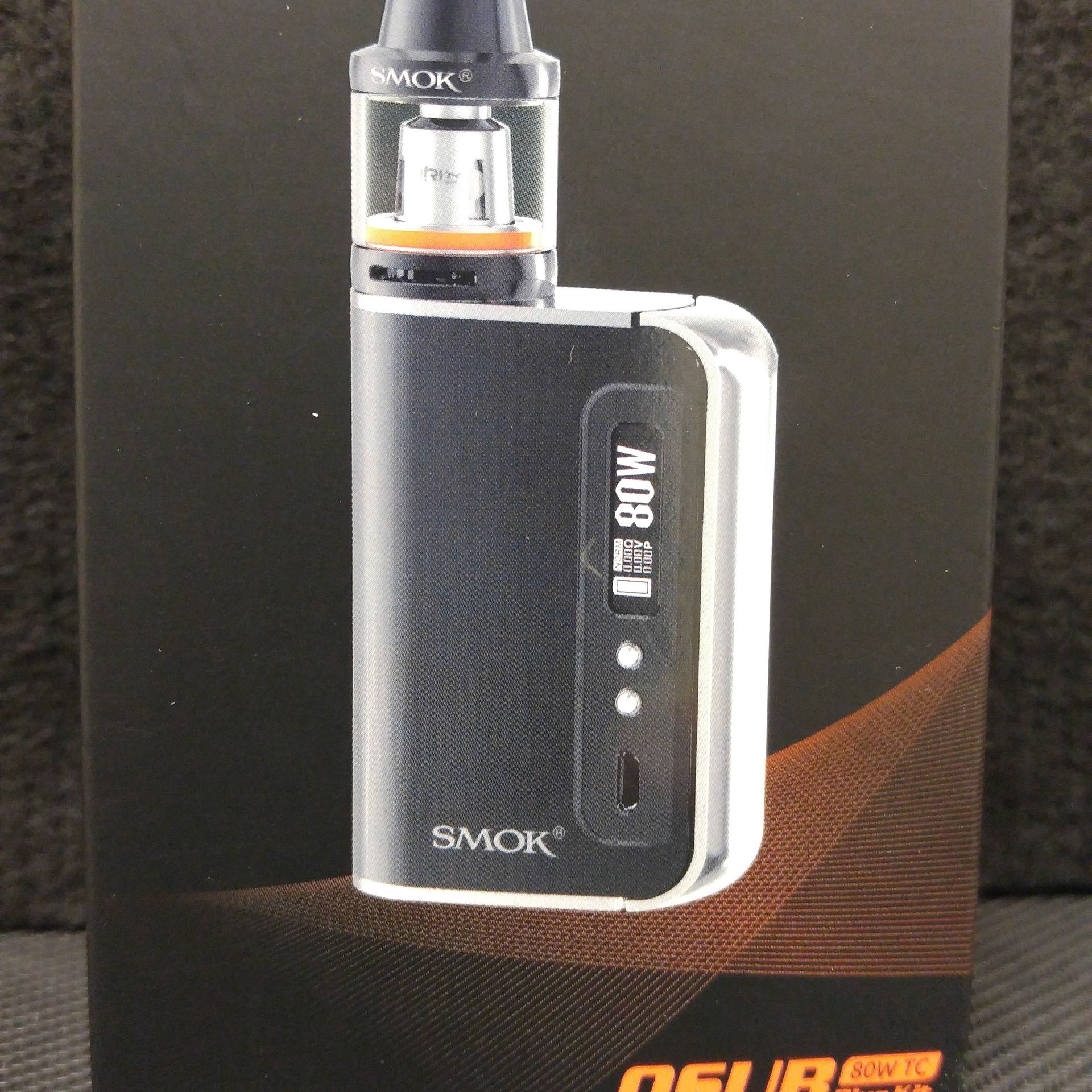 A box with a smok device inside of it