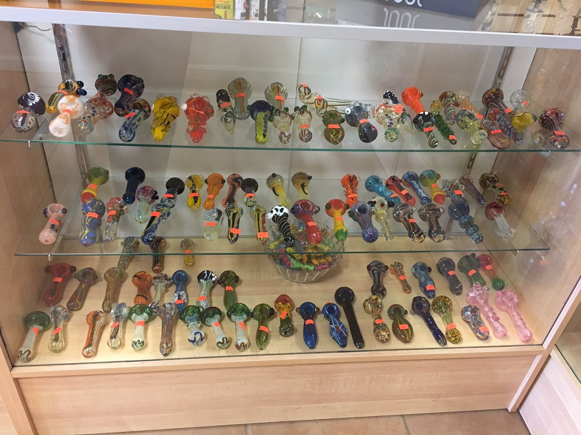 A display case filled with lots of different types of pipes