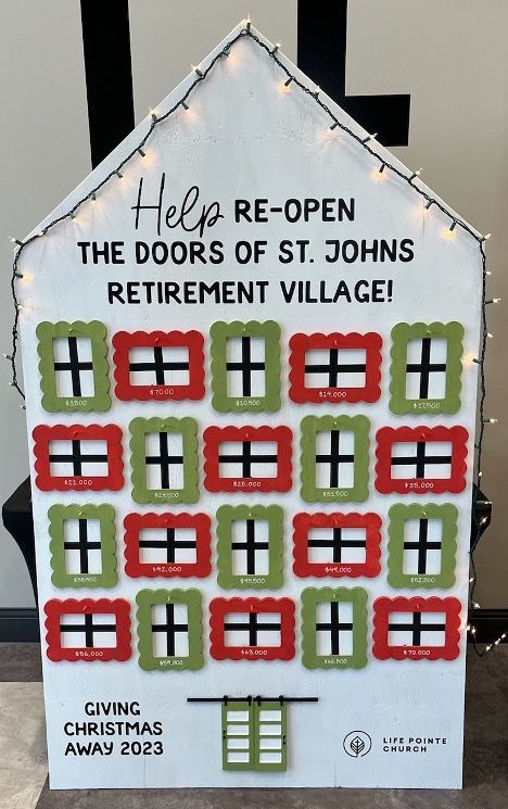 A sign that says help re-open the doors of st. johns retirement village