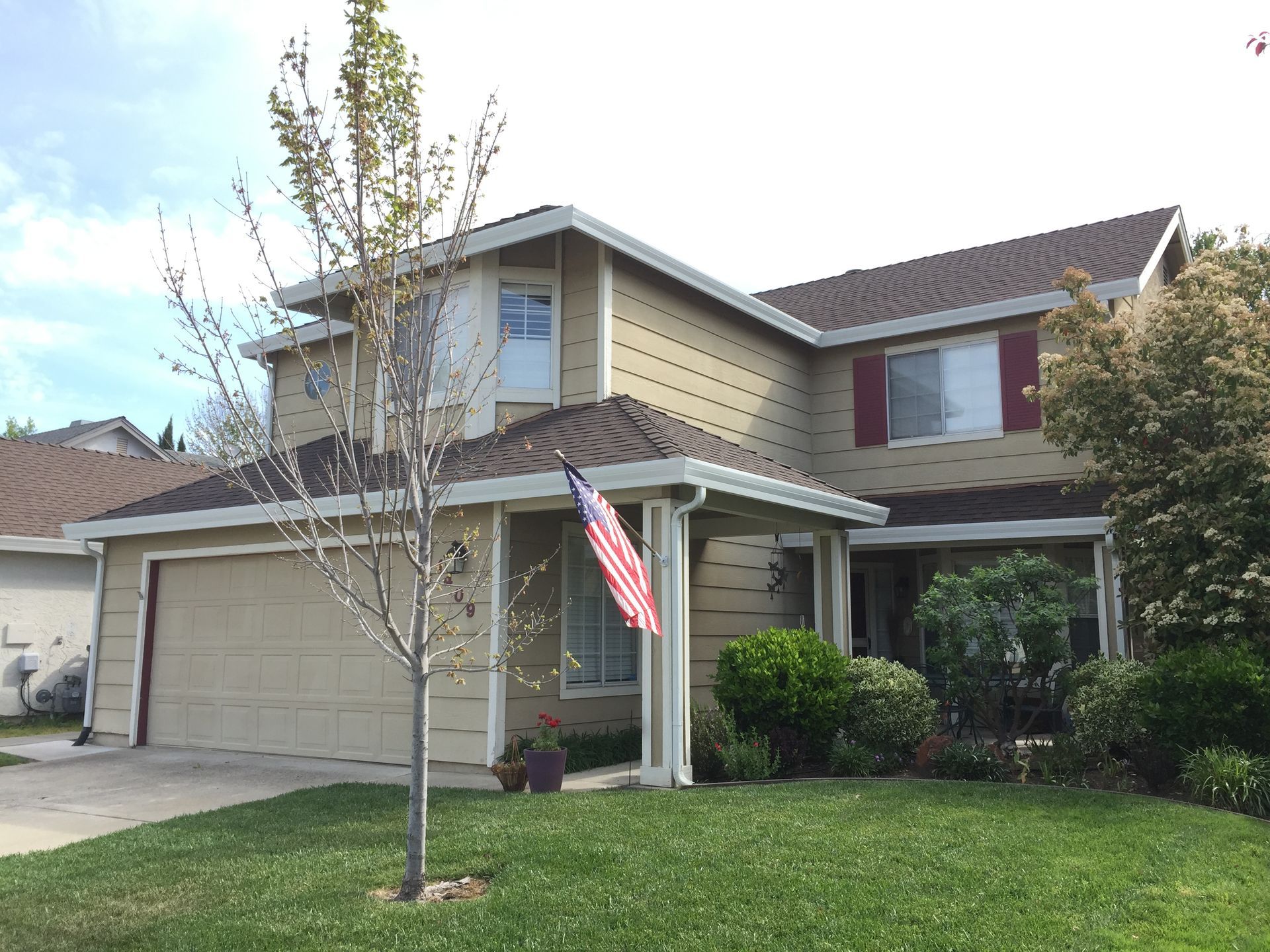 A house with an american flag in front of it