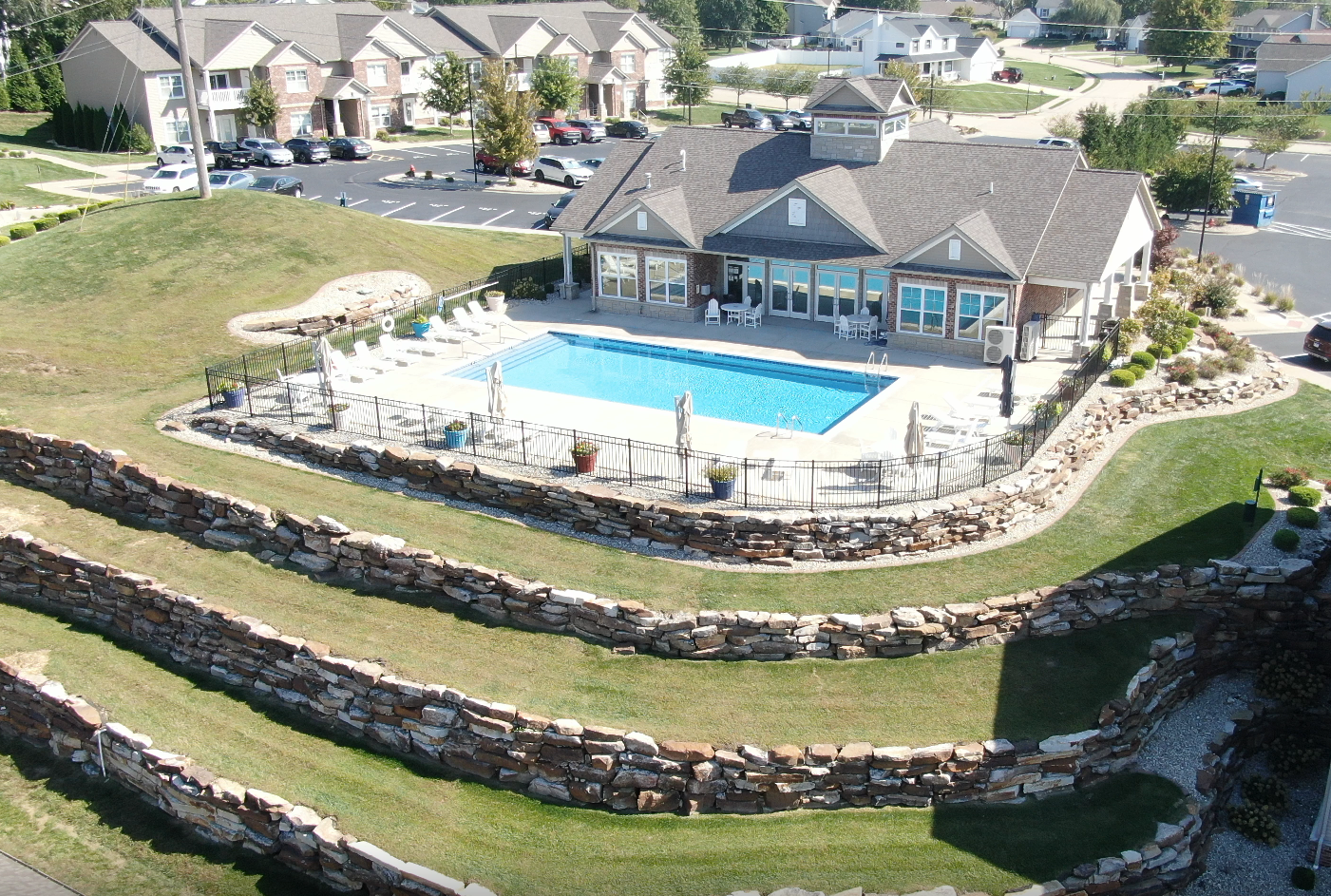 An aerial view of a swimming pool in a residential area