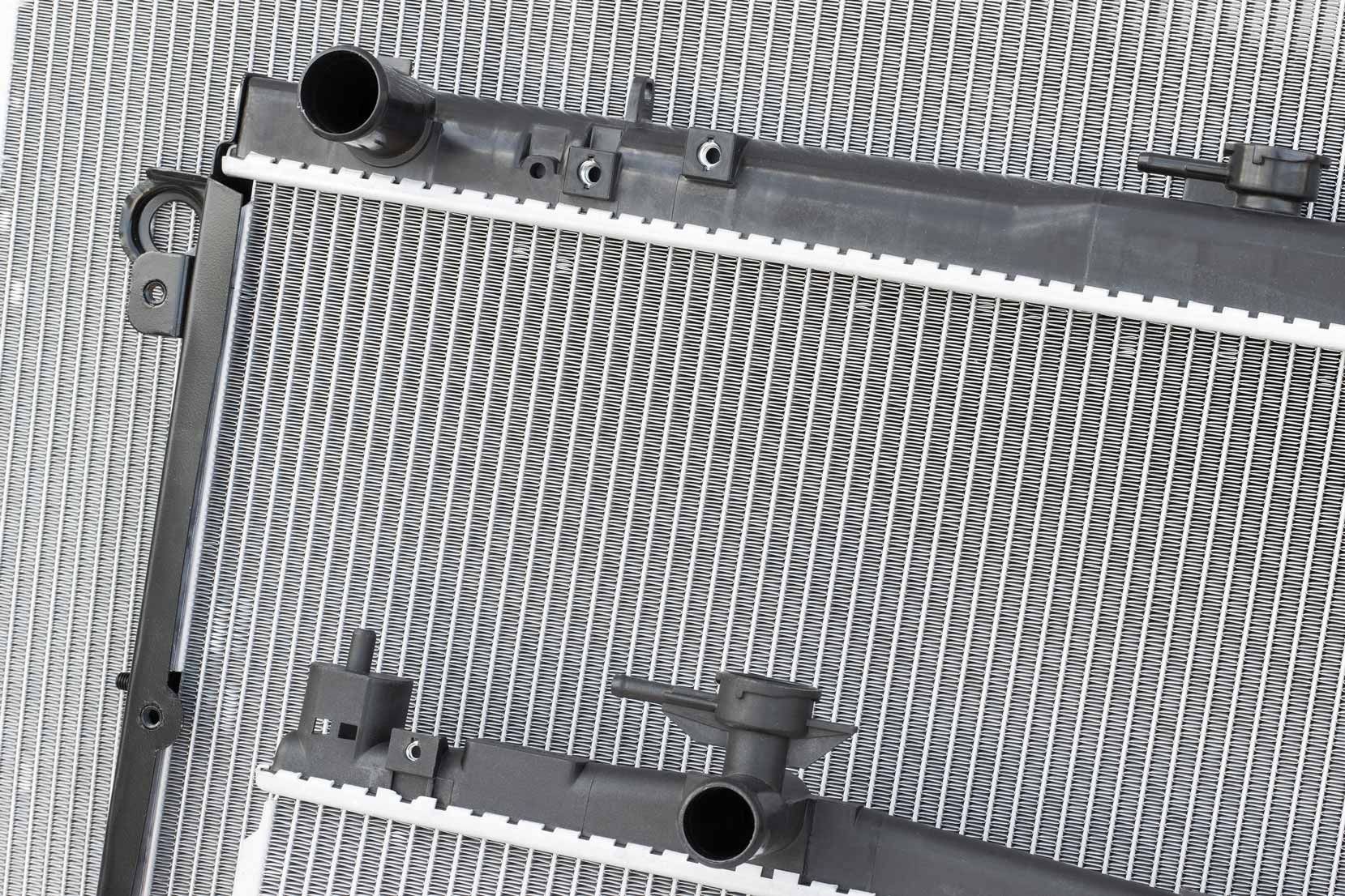 Three engine cooling radiators of different sizes.
