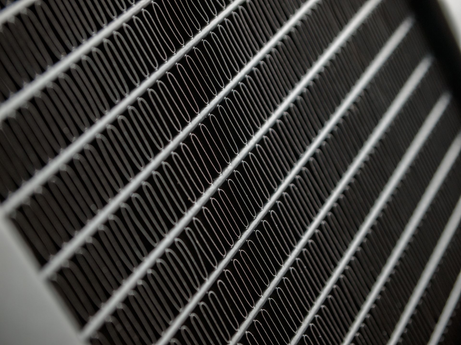 A close-up of an air heat exchanger grid.
