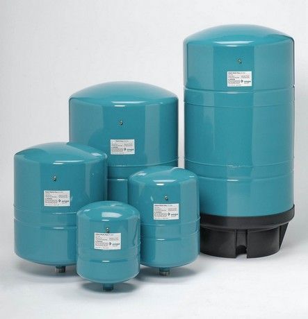 A group of blue water tanks are stacked on top of each other.