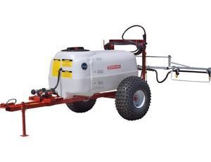 A sprayer is attached to a trailer with large tires.