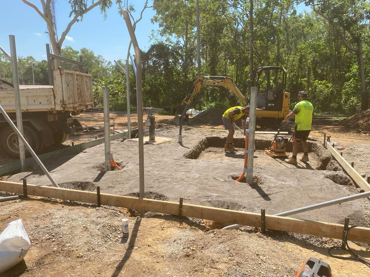 A group of construction workers are working on a construction site.
