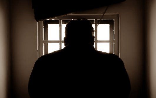 Man in a detention cell