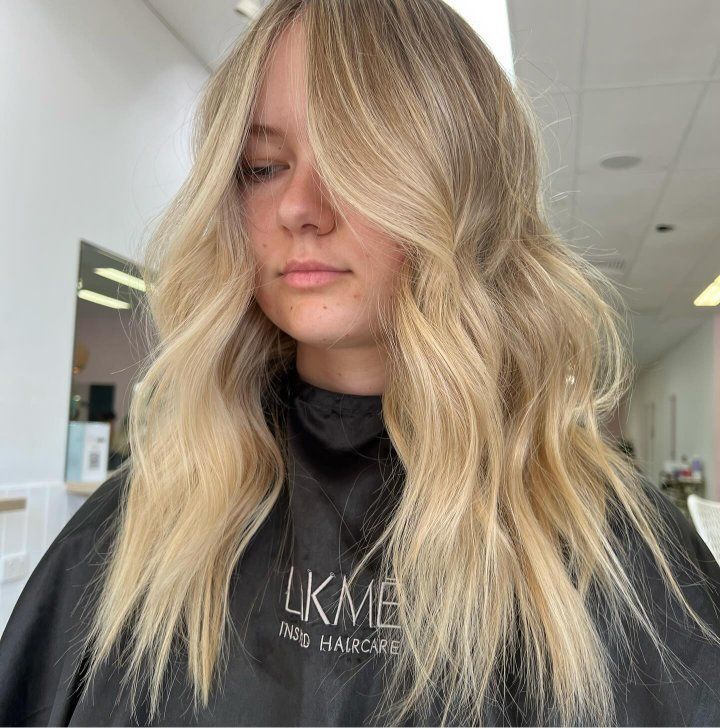 A Woman With Long Blonde Hair — The Hair Boutique Co In Varsity Lakes, QLD