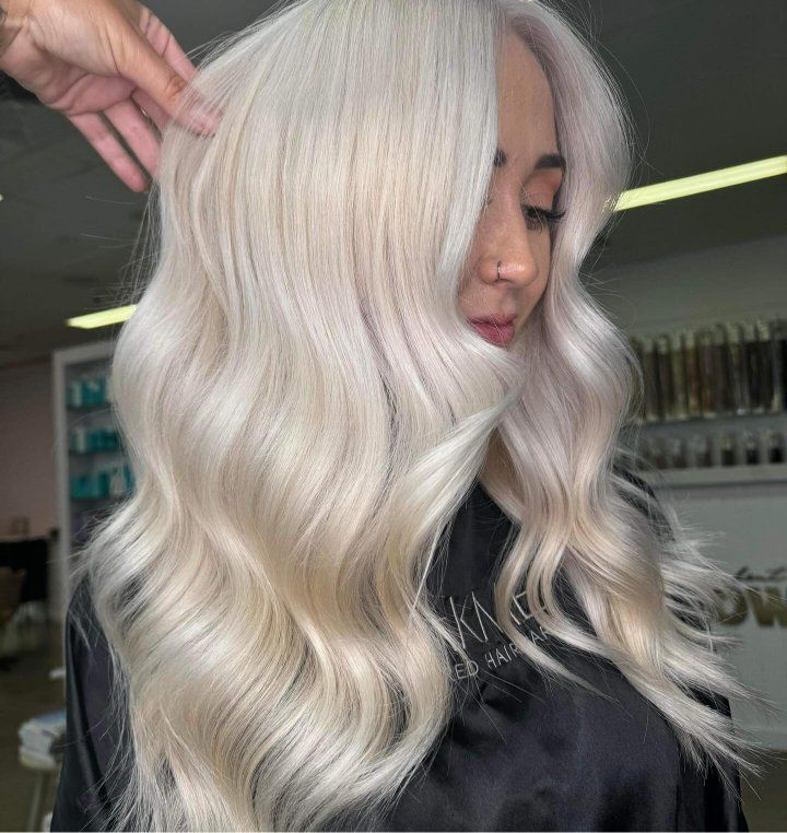 A Woman With Long White Hair Is Getting Her Hair Done In A Salon — The Hair Boutique Co In Varsity Lakes, QLD