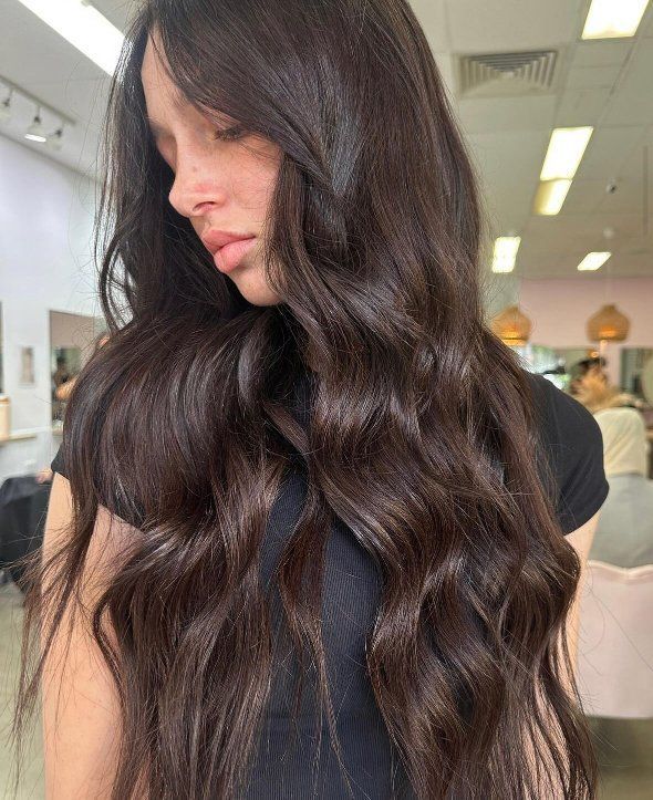 A Woman With Long Brown Hair Is Standing In A Salon — The Hair Boutique Co In Varsity Lakes, QLD