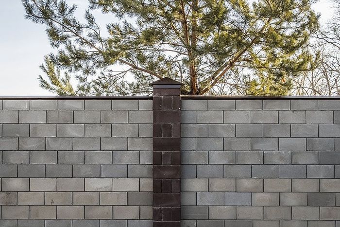 a pre-cast concrete fence
