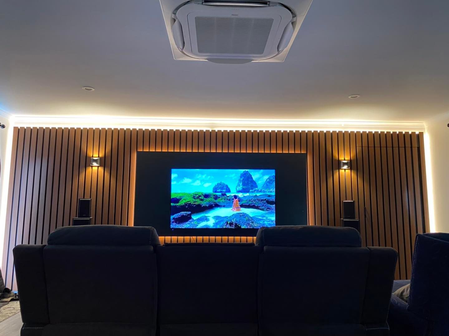 Home Theater With Large Screen, Wooden Paneling, and Seating — Lahtinen Electrical & Refrigeration in Ingham, QLD