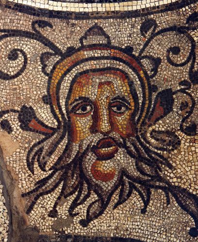 Mosaic of a bearded face with a halo and swirling decorative background