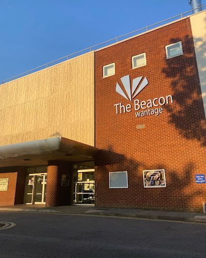 Exterior of The Beacon Wantage building with brick and wood facade in daylight