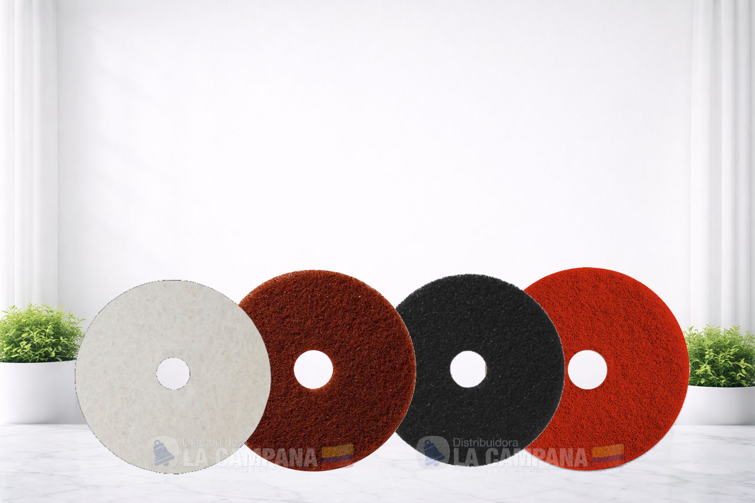 Four round textured floor mats in gray, brown, black, and red on a white floor