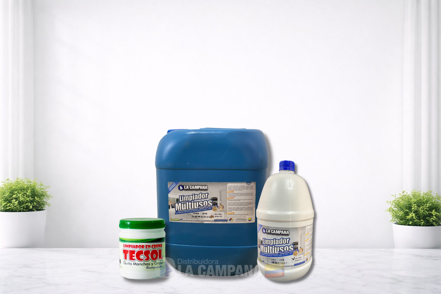 Three cleaning product containers on a white table: a blue drum, white bottle, and small jar with red lid.