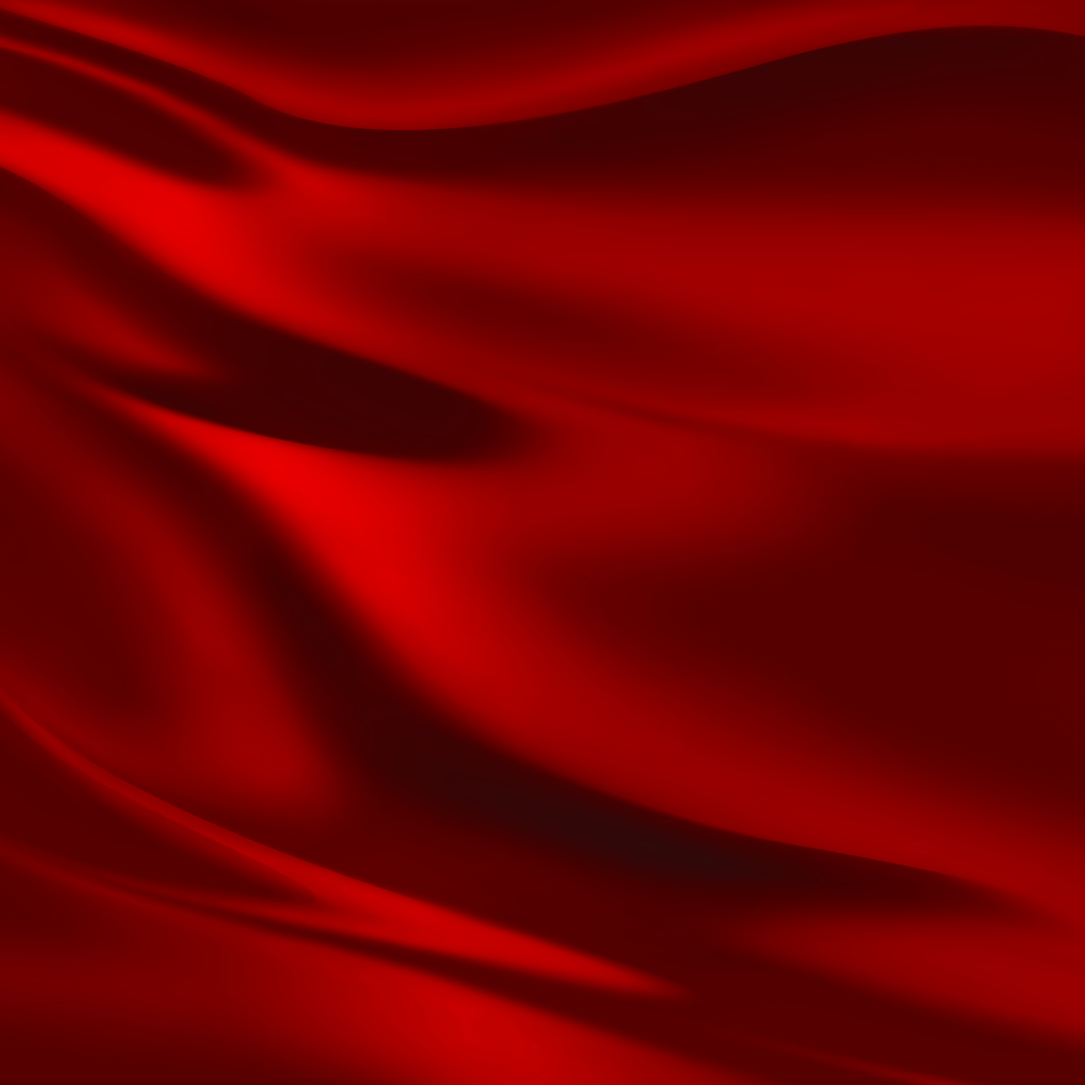 Red fabric draped in flowing folds.