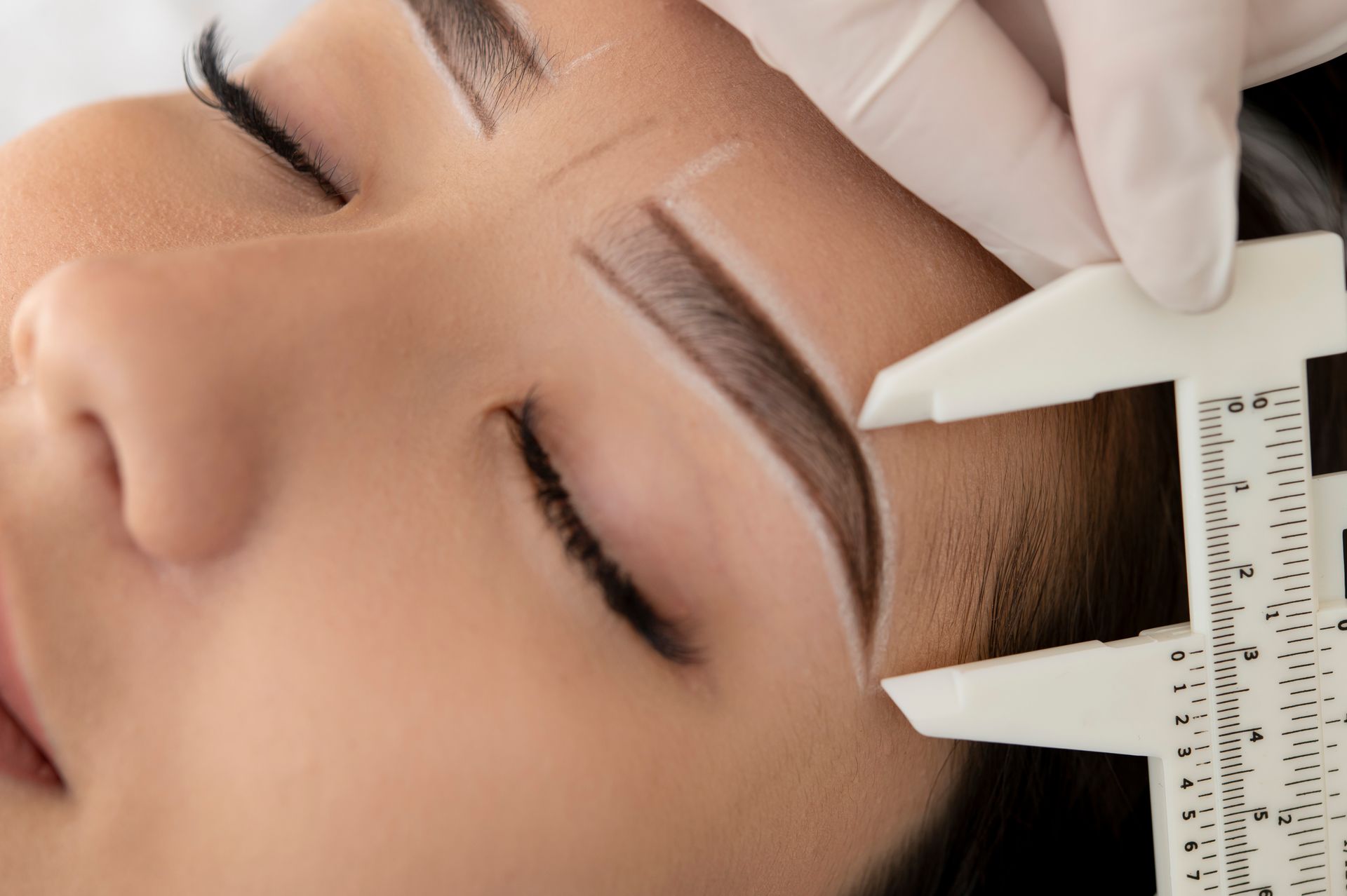 woman getting eyebrows done