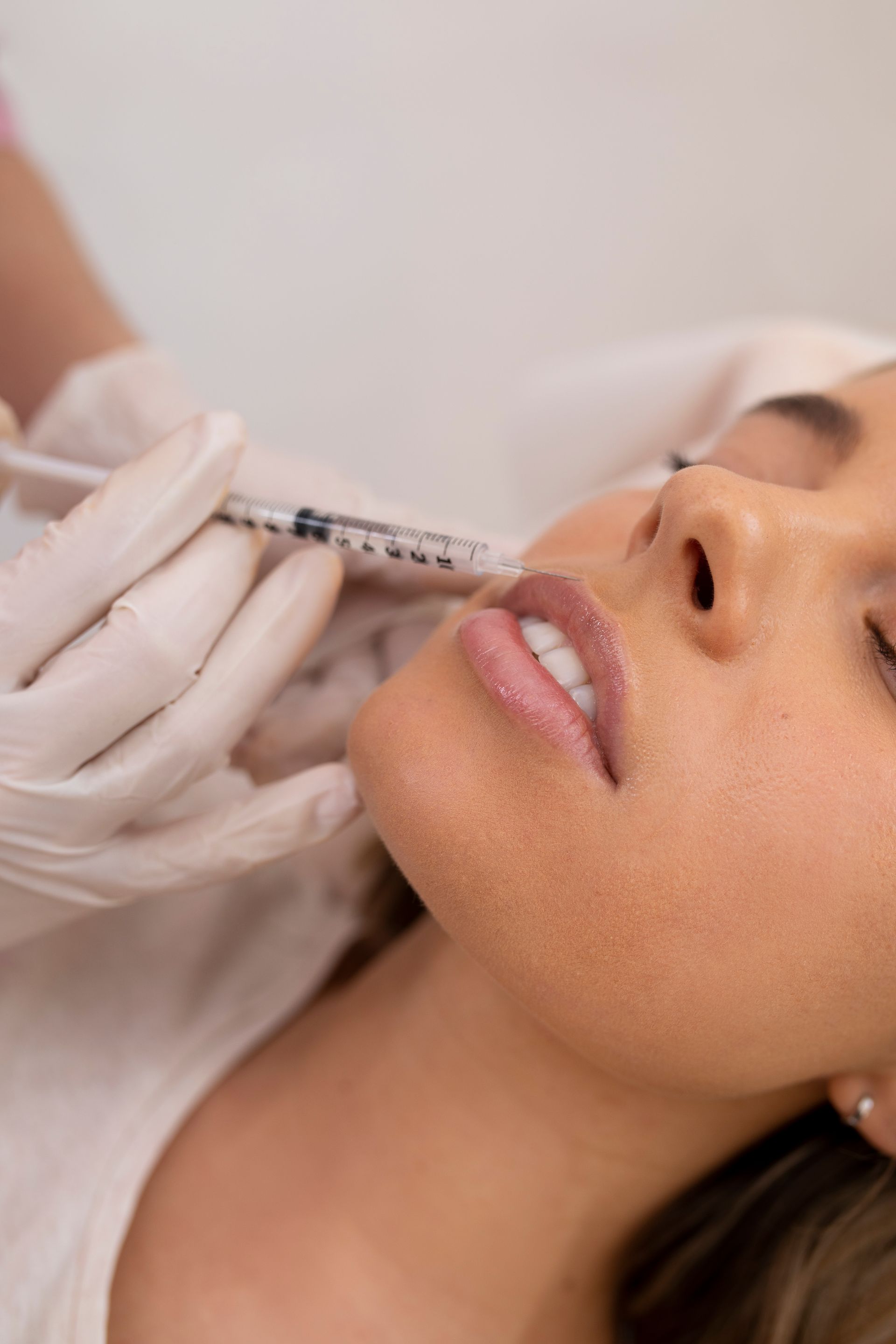 woman getting lip fillers