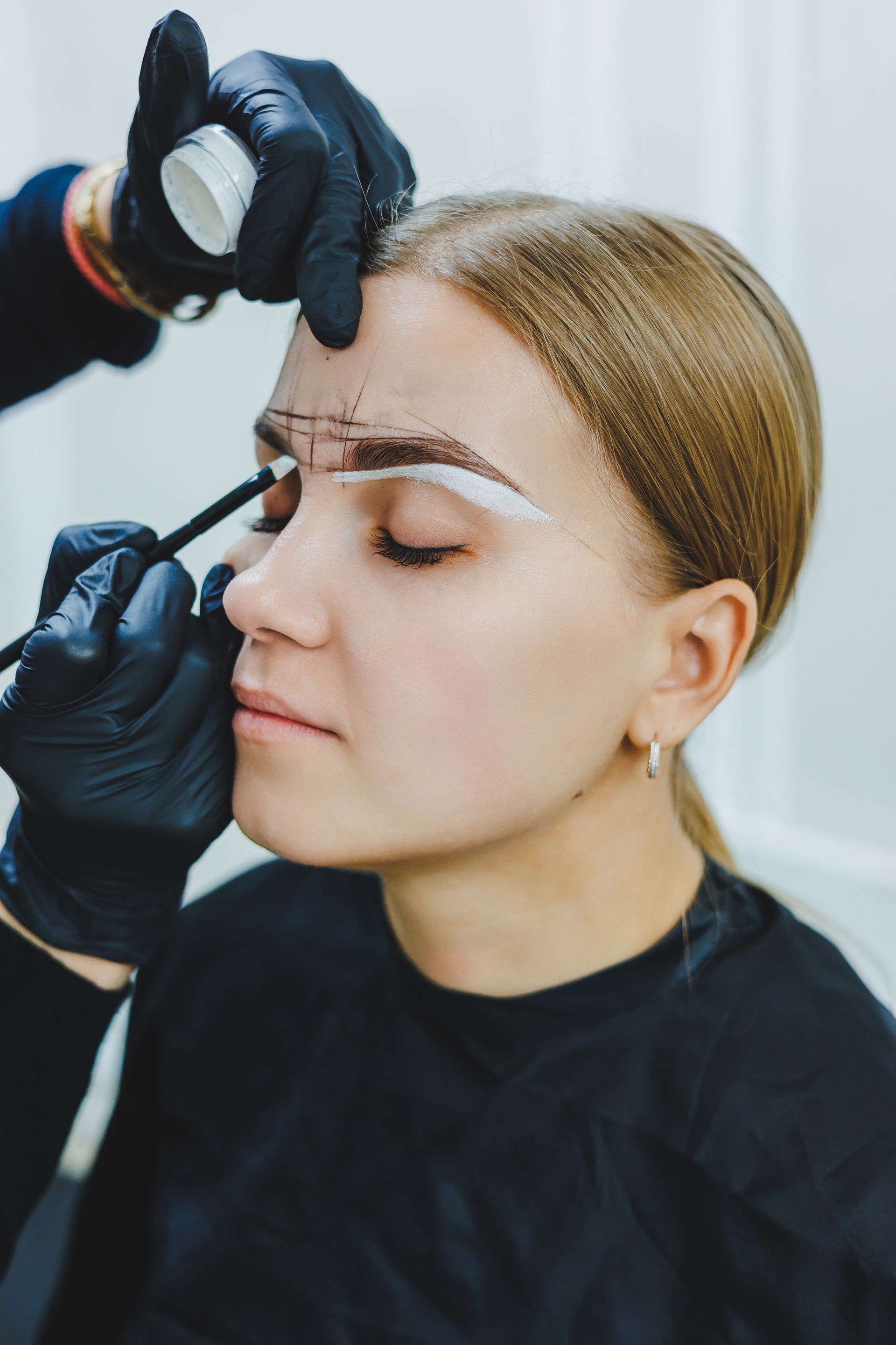 woman getting permanent brow makeup