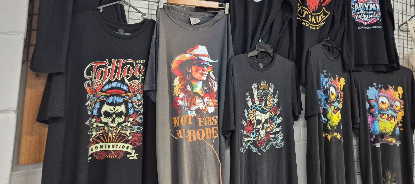 Black T-shirts Displaying Colorful Halloween-themed Pumpkin — Al's Custom Prints in Wyong, NSW