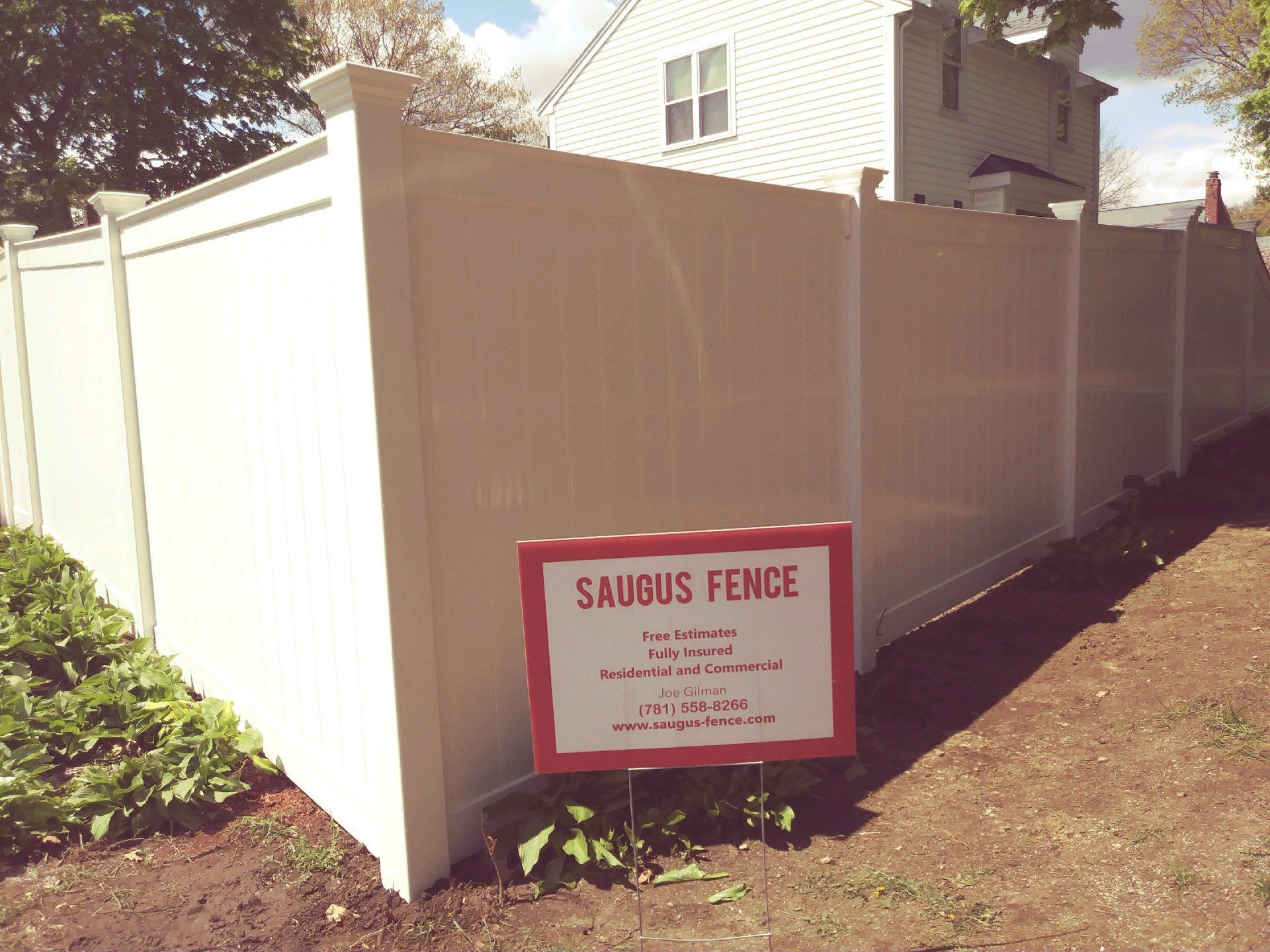 White vinyl fence by 