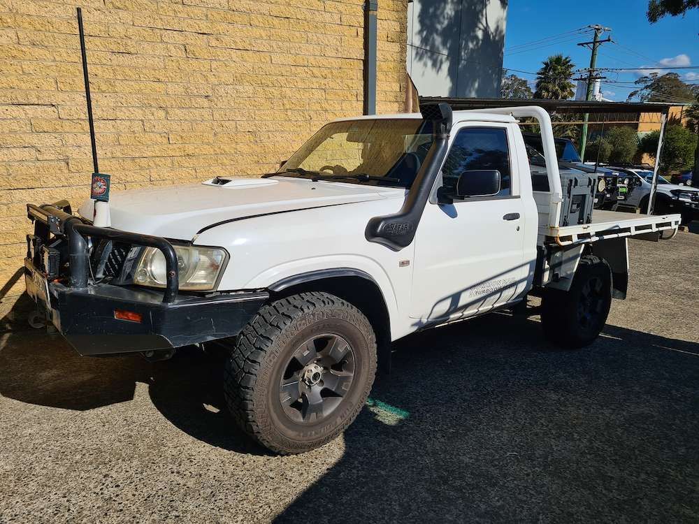 White Nissan Patrol Pickup Truck With Black Bull Bar — Greens Diesel Tune in Camden, NSW