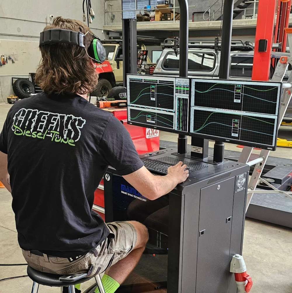 Mechanic Tuning an Engine on a Dyno, Wearing Headphones — Greens Diesel Tune in Narellan, NSW