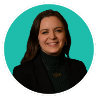 Photo of white woman with dark brown hair wearing a black turtleneck sweater