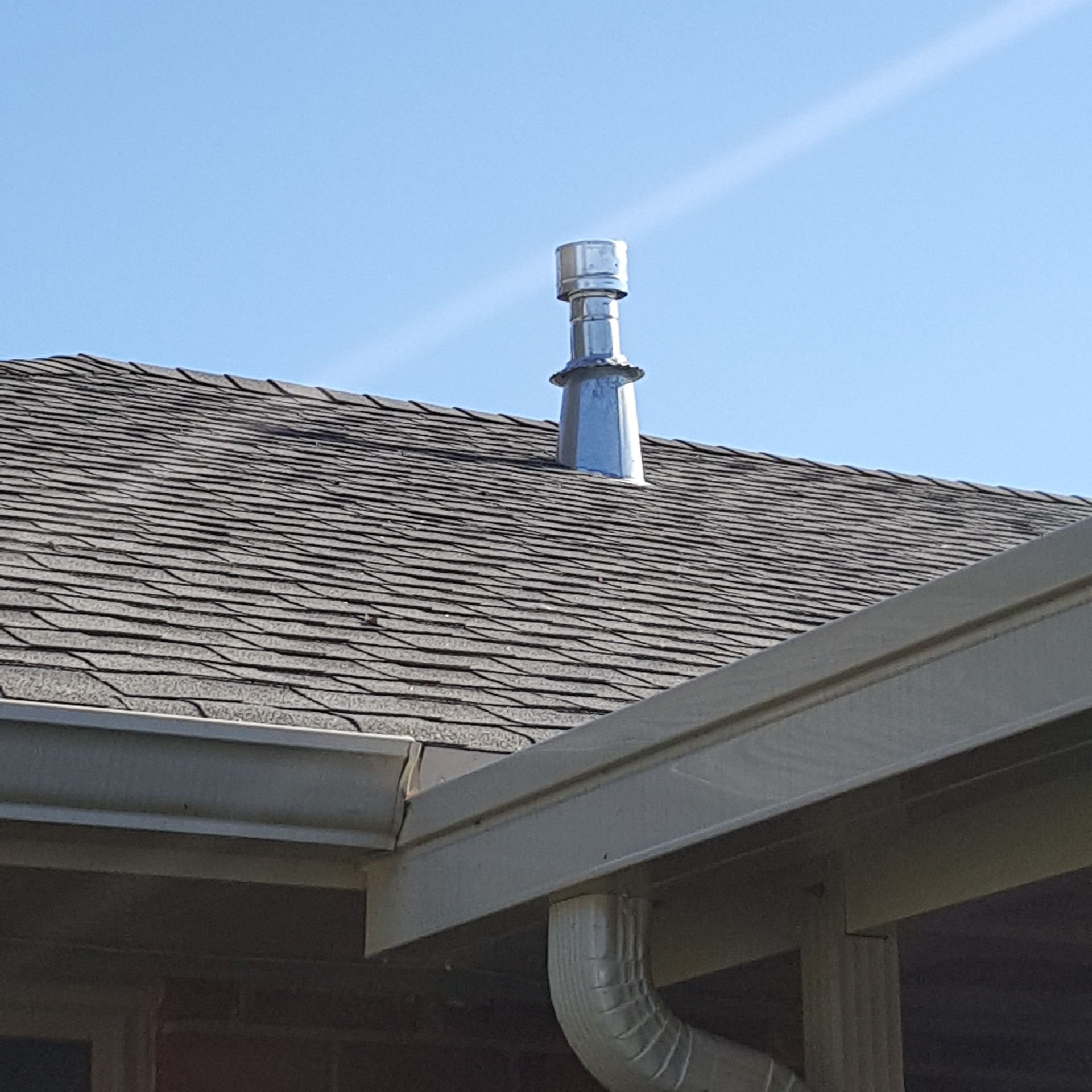 A roof with a chimney on top of it