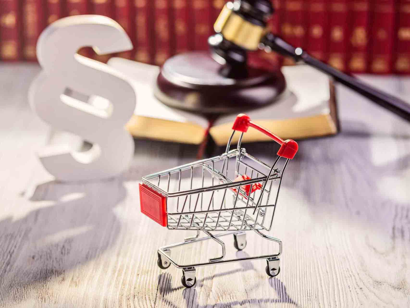 Little Trolley | Little Rock, AR | Thompson Law Firm, PLLC Shopping cart in front of a legal symbol, open book, and gavel, possibly representing e-commerce law.