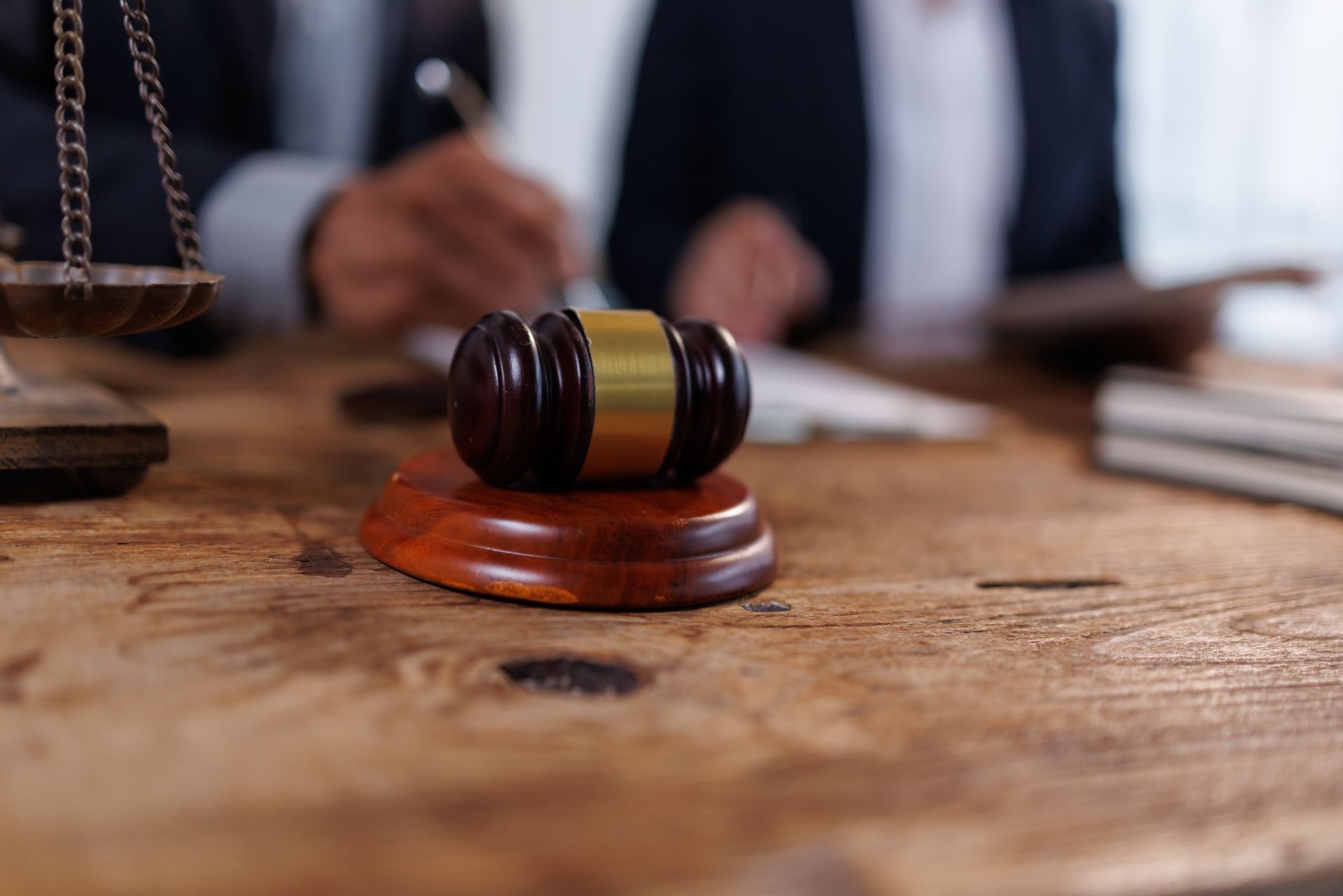 Gavel and scales of justice on a wooden desk