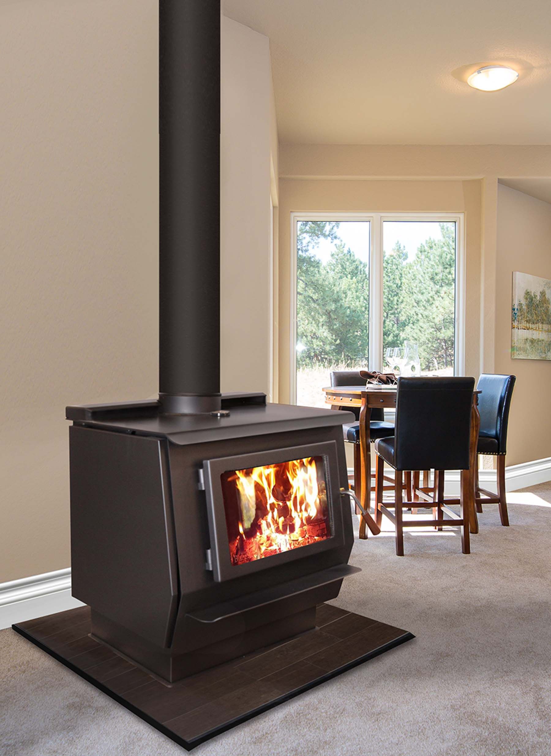 A wood-burning stove with a visible fire is set in a living room with a dining table and window. The stove has a black pipe.