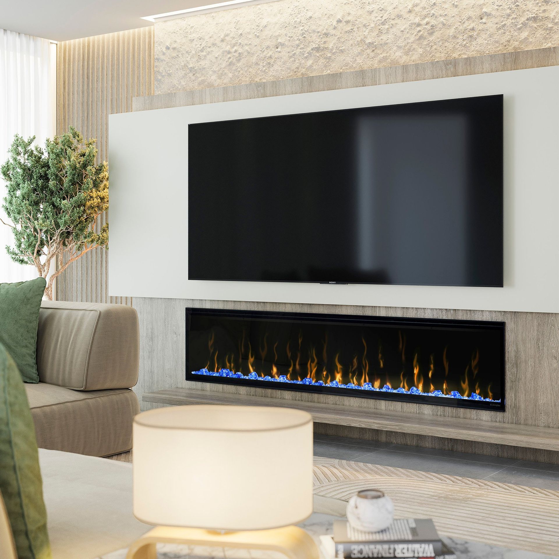 Modern living room with a large flat-screen TV mounted above an electric fireplace. A sofa, lamp, and plant are in view.