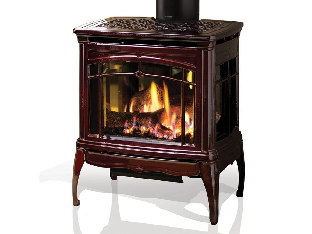 A maroon gas stove with flames burning inside. The stove has a decorative design and black chimney.