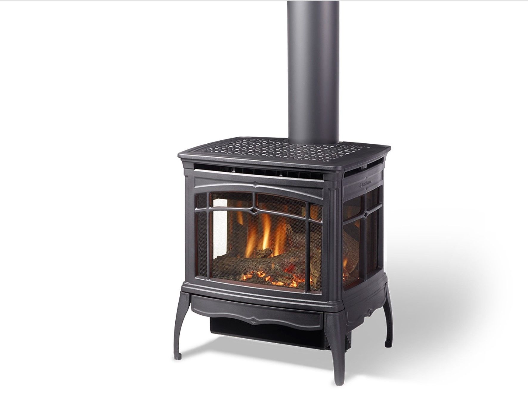 Black gas fireplace with a chimney. It has a visible flame behind glass panels.