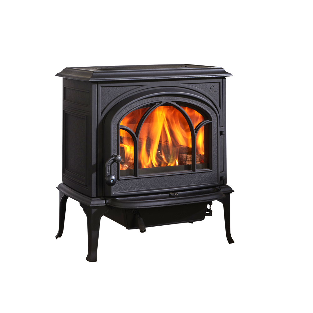 Black cast iron wood-burning stove with flames visible through arched glass door.