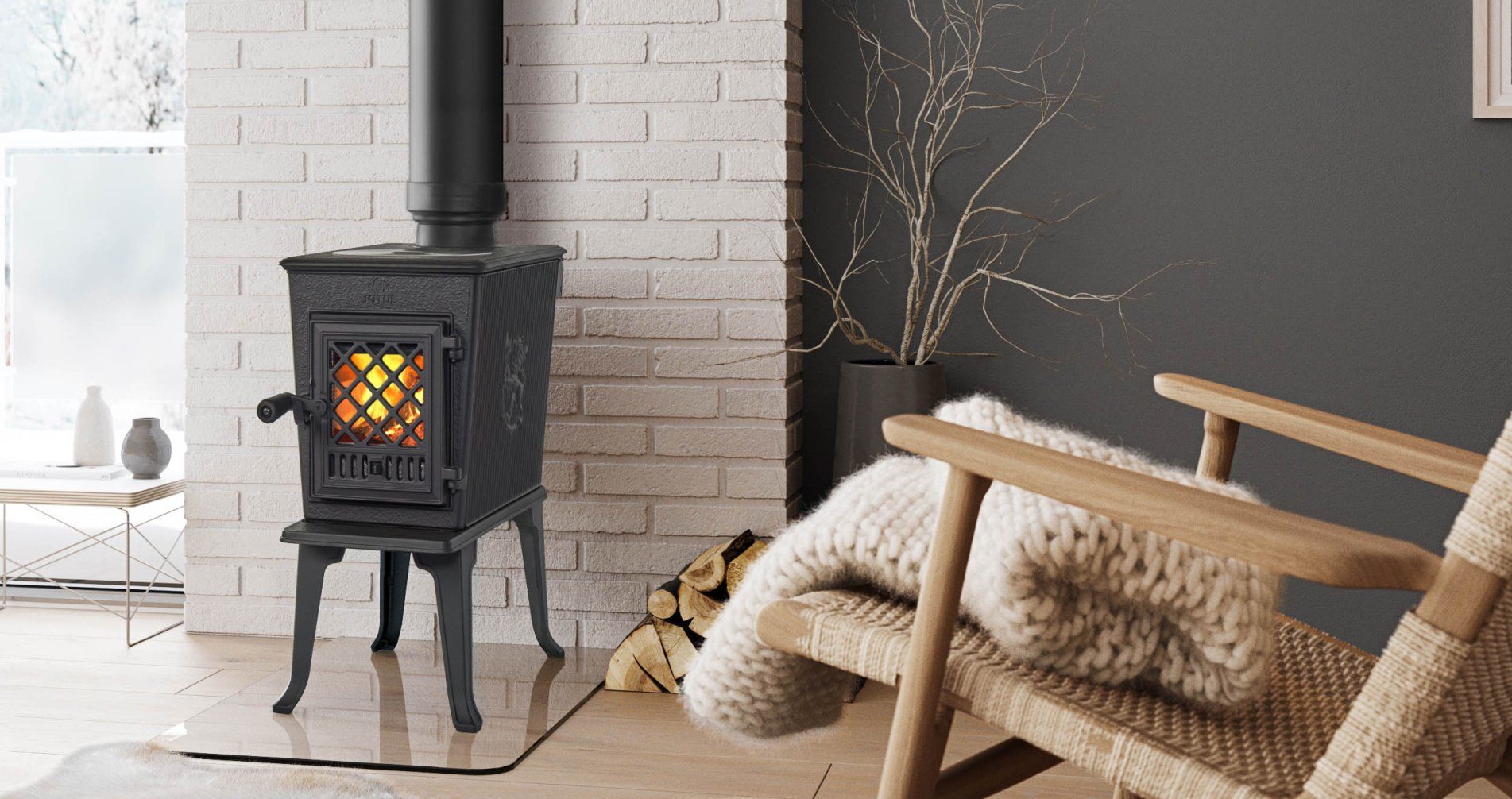 A cozy living room featuring a cast iron stove with a lit fire, a wooden rocking chair, and a white brick wall.