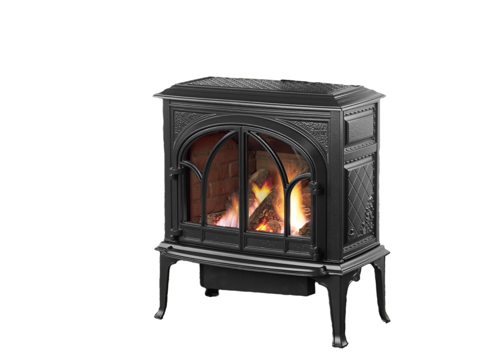 Black cast iron fireplace with glass doors, burning flames.  Ornate detailing on the sides and top.