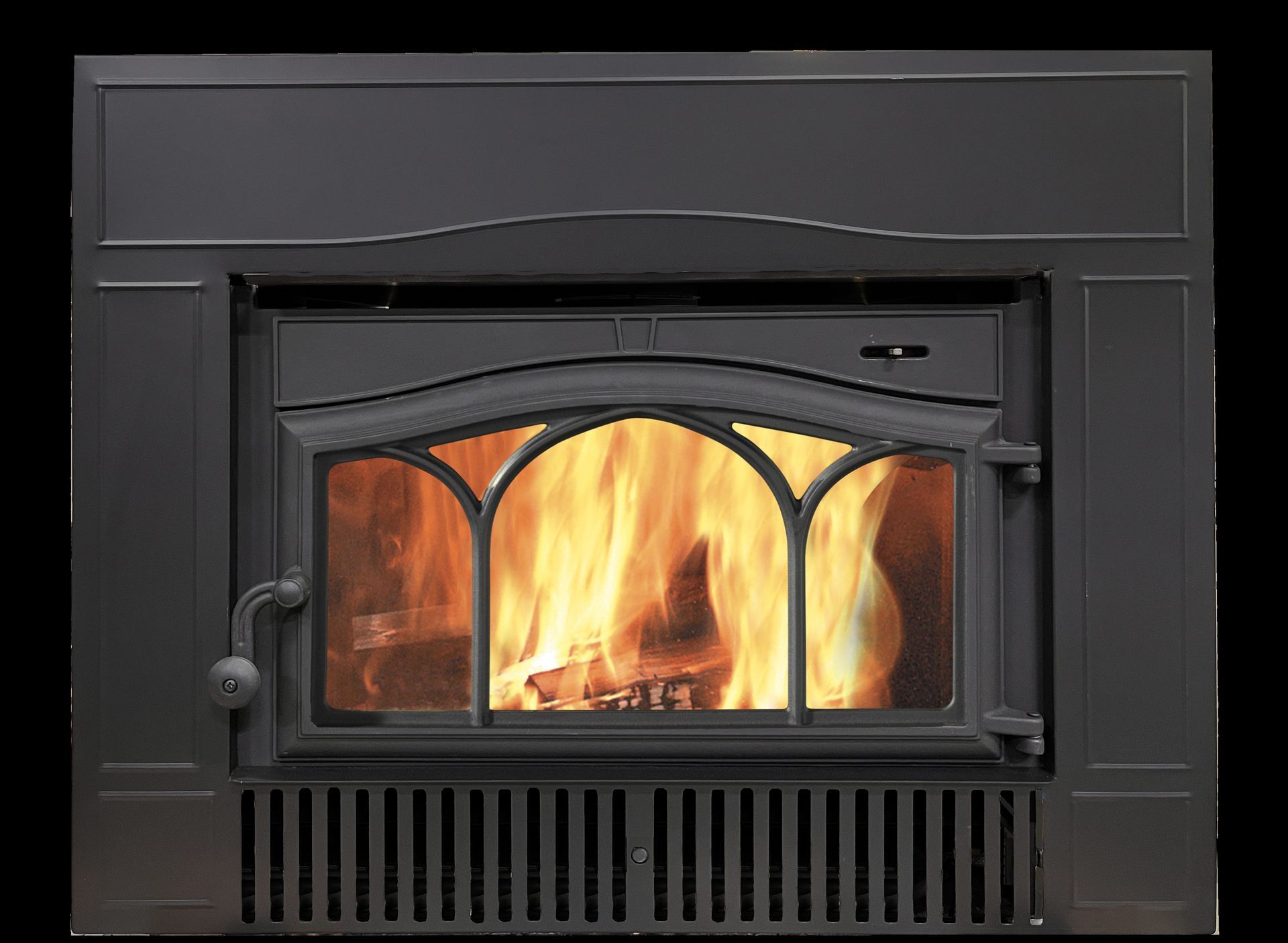 A black fireplace with a burning fire inside. Flames are visible through the glass door.