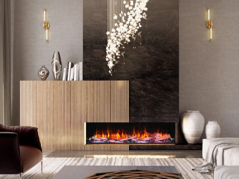 Living room with a fireplace and modern decor in neutral tones. Features include a light wood cabinet, marble wall, and a chandelier.