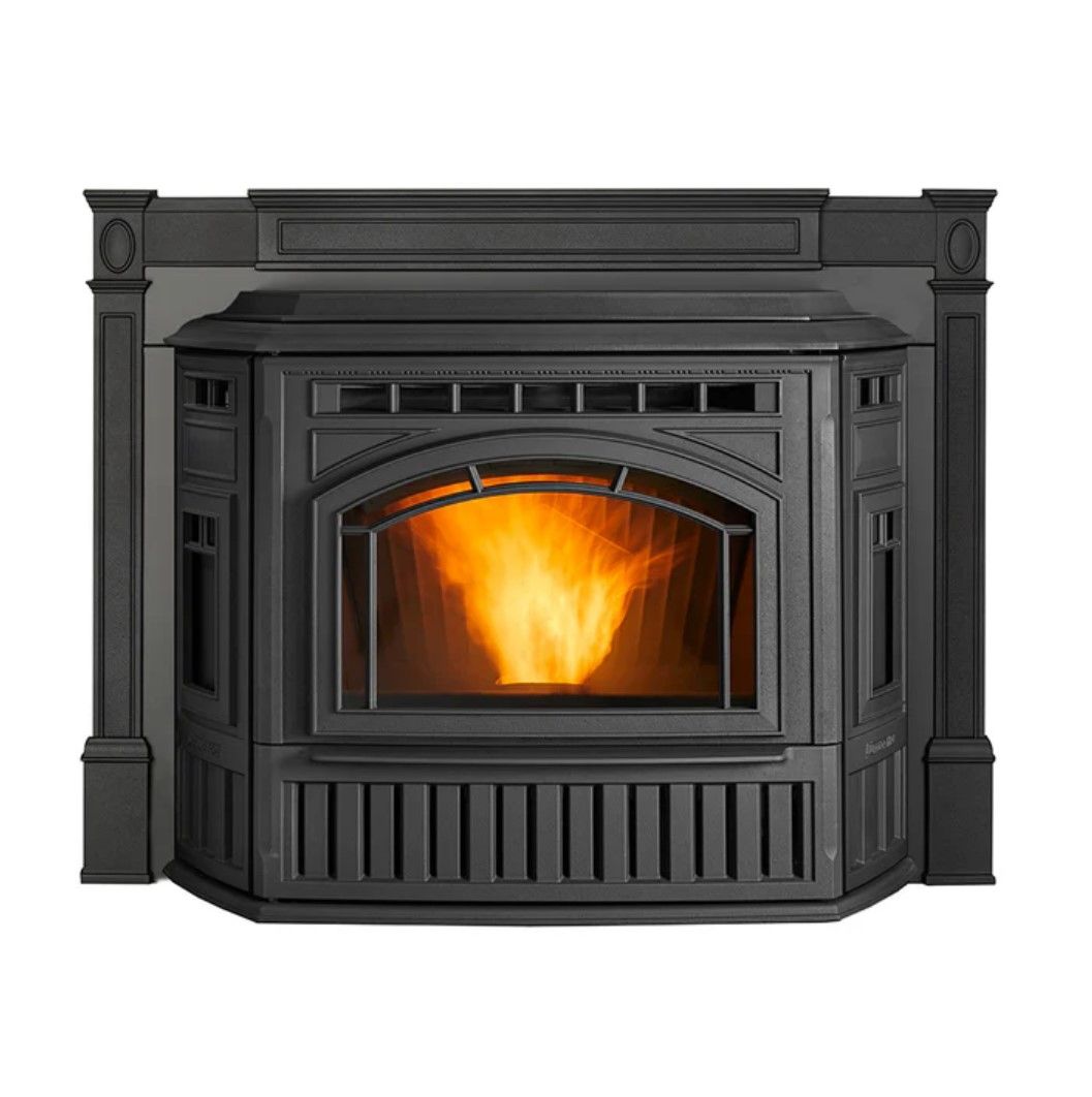Black pellet stove with a fire burning inside, showing flames through the arched window.