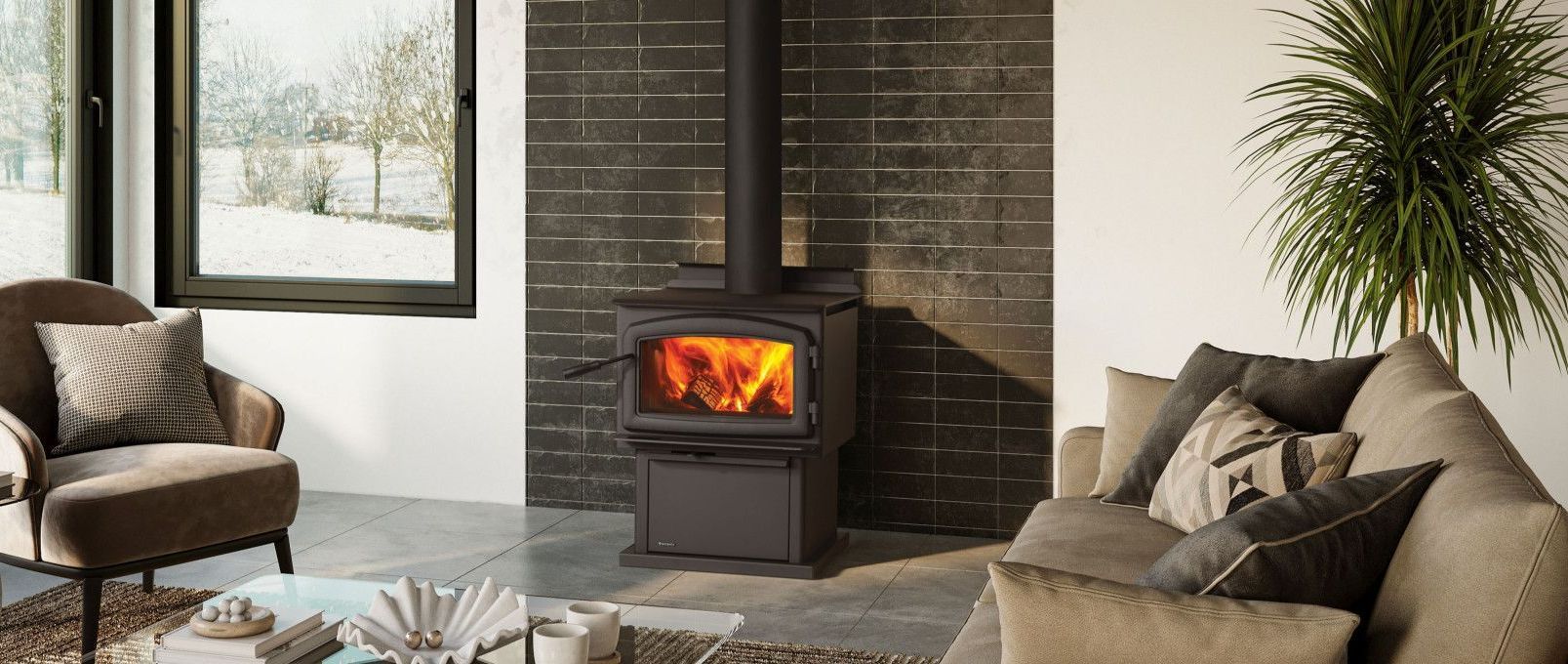 Cozy living room with a lit fireplace against a dark brick wall, flanked by a window, armchair, and a sofa.
