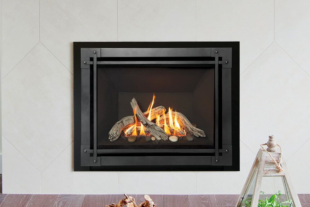 A modern fireplace with a black frame and burning gas logs. It's mounted on a white wall with a geometric design.