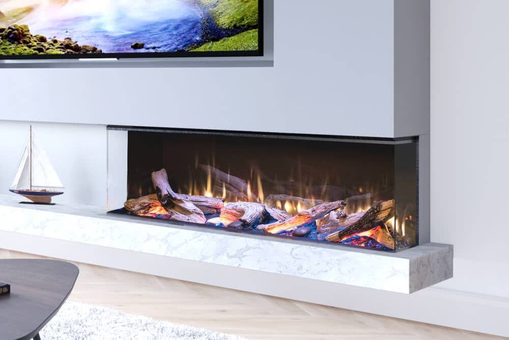 Electric fireplace built into a white wall, displaying artificial flames and logs. A TV is mounted above, with a small sailboat model to the left.