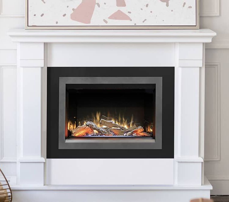 White fireplace mantel with a black fireplace insert showing flames and logs.